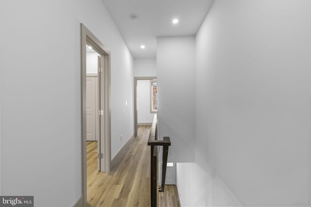 hall with light hardwood / wood-style floors