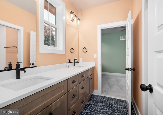 bathroom with vanity and tile patterned floors