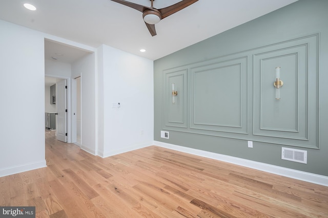 empty room featuring light hardwood / wood-style floors and ceiling fan