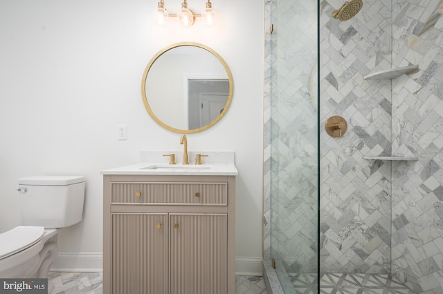 bathroom featuring a shower with door, toilet, and vanity