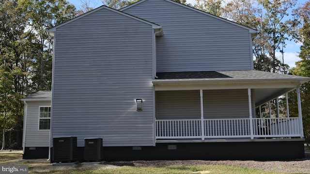 view of side of property featuring central AC