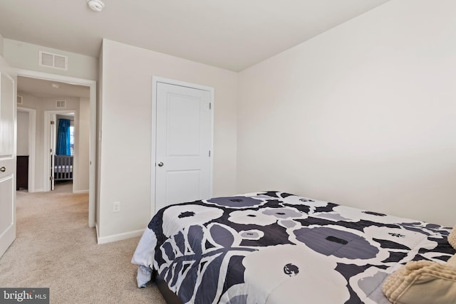 bedroom with light colored carpet