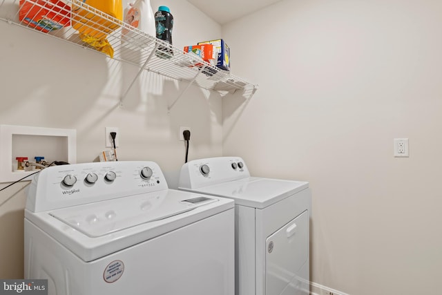 laundry area featuring washing machine and dryer