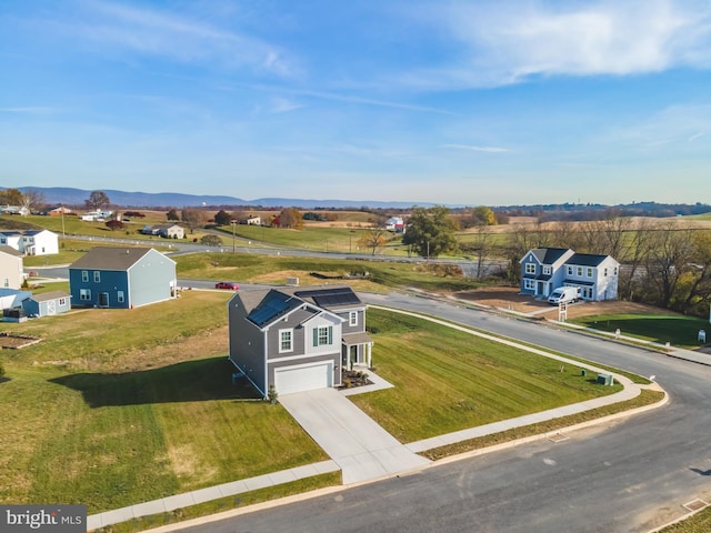 birds eye view of property featuring a mountain view