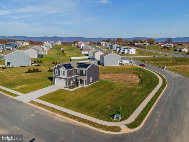 birds eye view of property featuring a mountain view