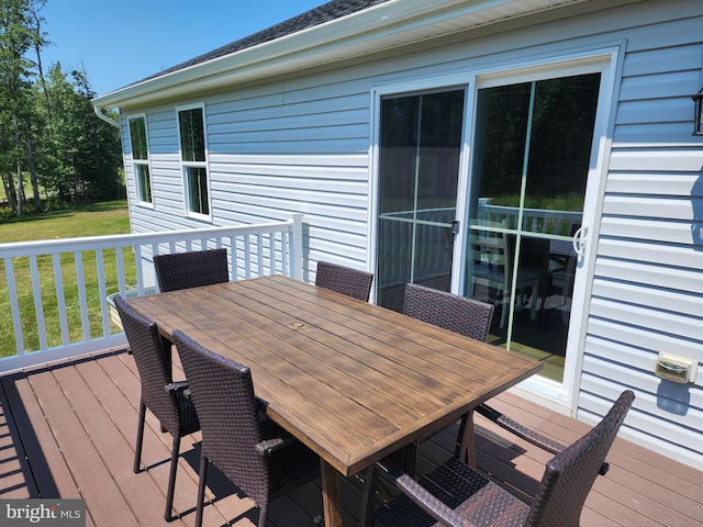 wooden terrace with a yard