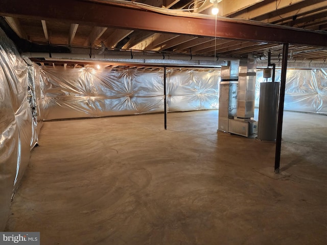 basement with water heater and heating unit