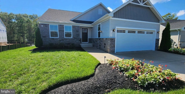 craftsman house featuring a front yard and a garage