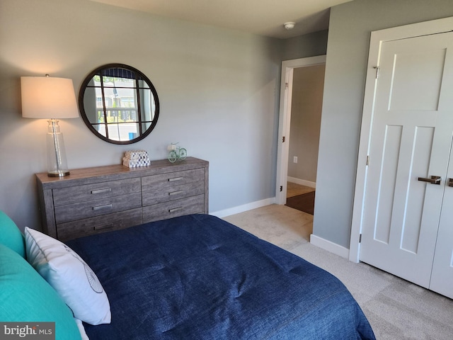 bedroom featuring light carpet