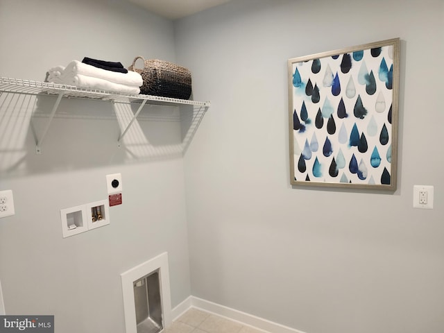 washroom with washer hookup, light tile patterned flooring, and hookup for an electric dryer