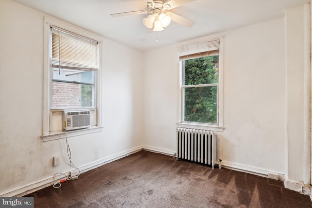 carpeted spare room with radiator, ceiling fan, plenty of natural light, and cooling unit