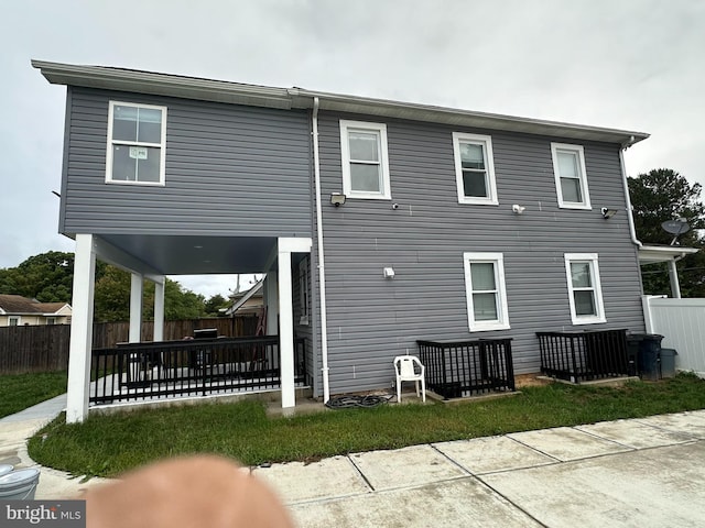 rear view of house with a lawn