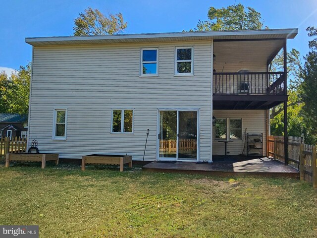 back of house with a yard and a patio area