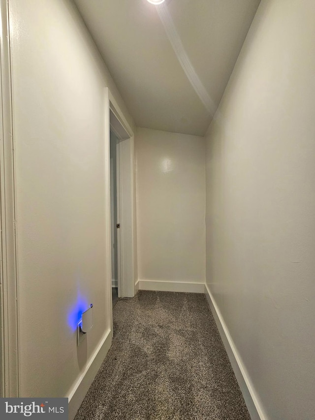 corridor with dark colored carpet