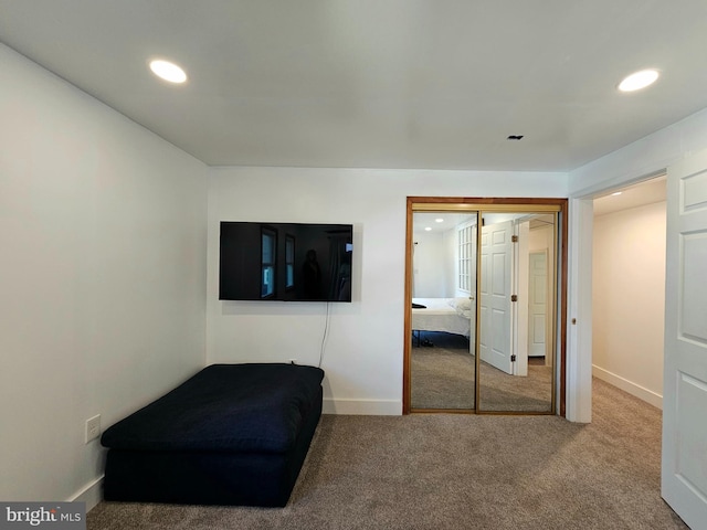 unfurnished bedroom with a closet and carpet