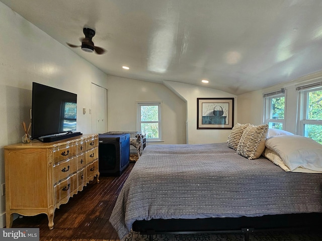 bedroom featuring lofted ceiling, dark wood-type flooring, and ceiling fan