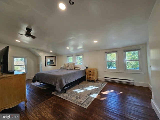 bedroom with vaulted ceiling, a baseboard heating unit, ceiling fan, and dark hardwood / wood-style flooring