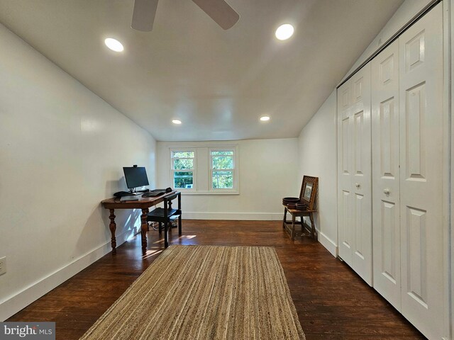 office space featuring dark hardwood / wood-style flooring and ceiling fan