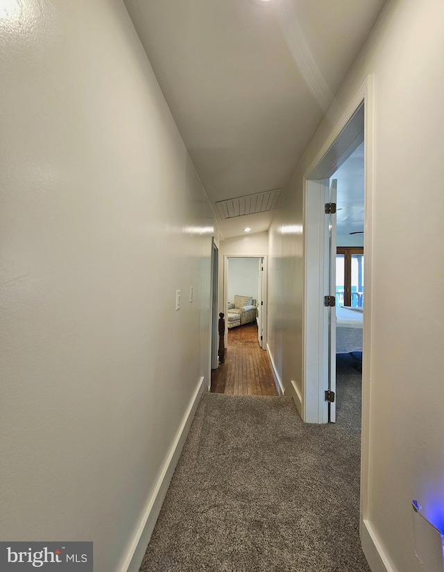 20826 Bivalve Wharf Rd, Bivalve, MD 21814 - hallway featuring carpet flooring, baseboards, and attic access