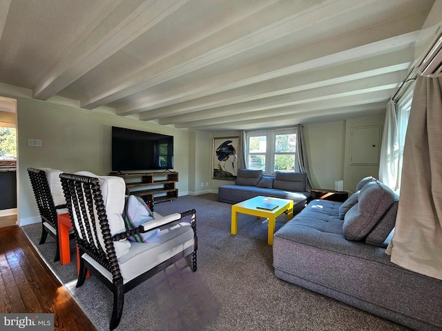 living room featuring beamed ceiling and dark hardwood / wood-style floors