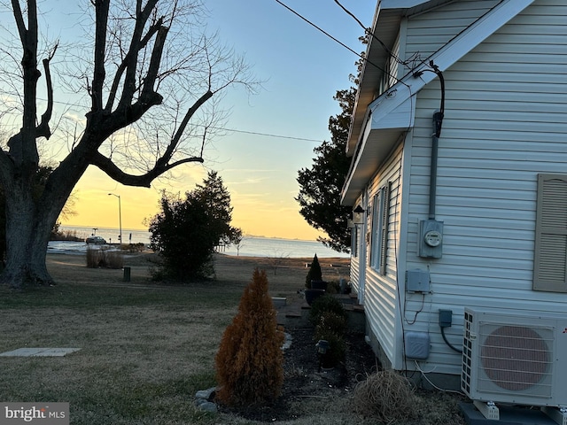 yard at dusk with ac unit