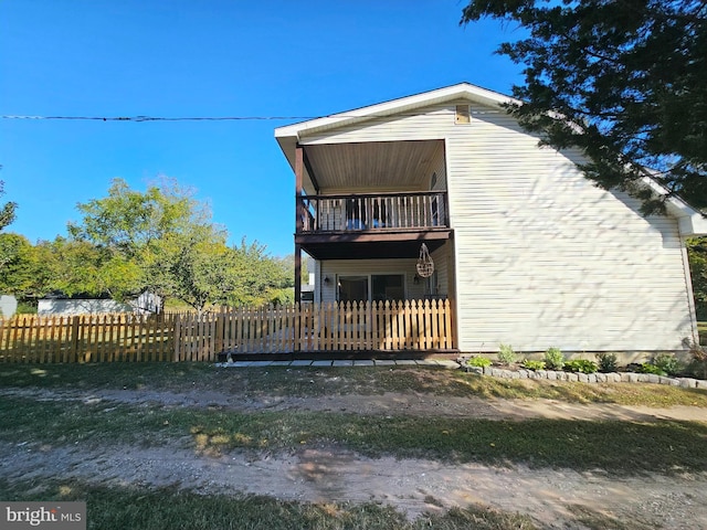 view of home's exterior with a balcony