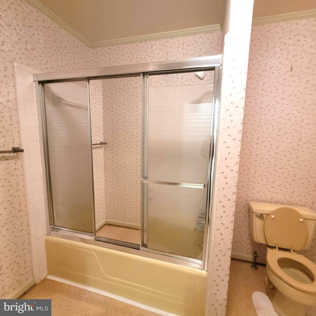 bathroom featuring crown molding, enclosed tub / shower combo, and toilet