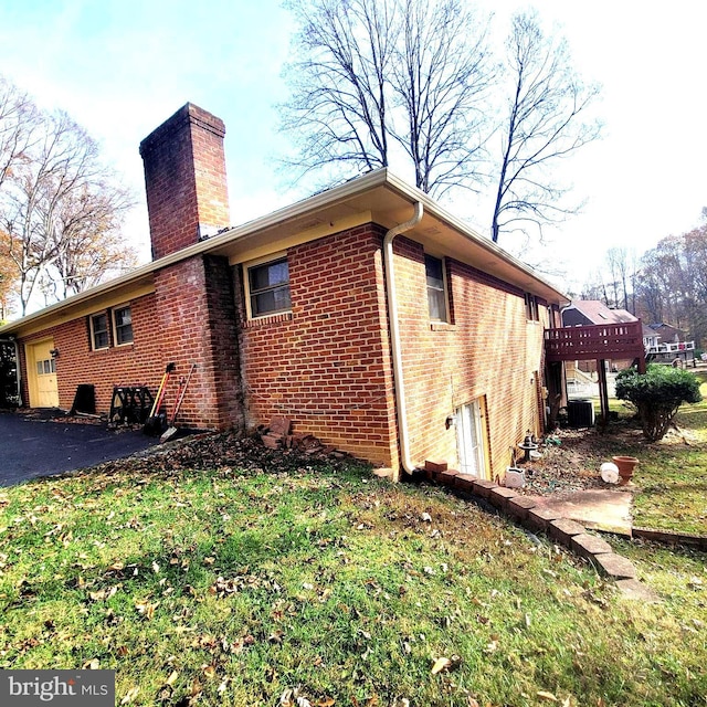 view of home's exterior with central AC unit