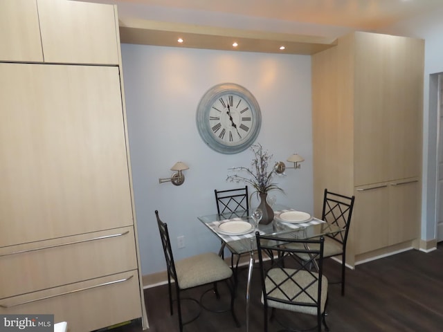 dining space with dark hardwood / wood-style flooring