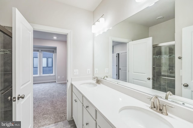 bathroom featuring vanity, tile patterned floors, and a shower with door