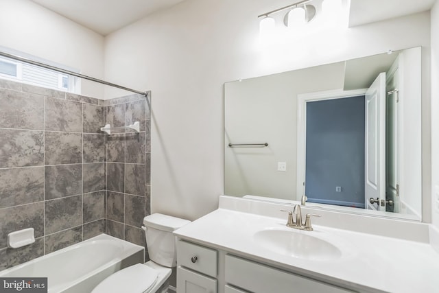 full bathroom with vanity, toilet, and tiled shower / bath