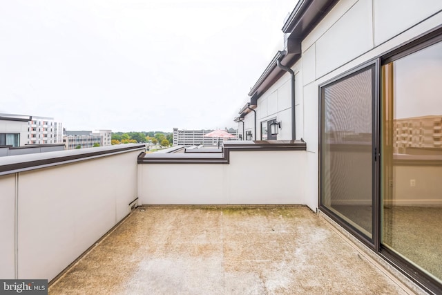 view of patio featuring a balcony