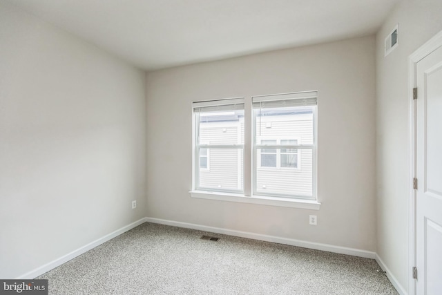 spare room with carpet floors