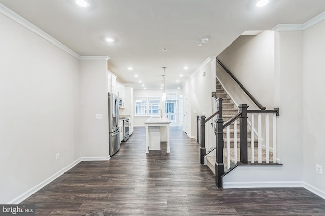 interior space with crown molding and dark hardwood / wood-style flooring