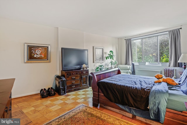 bedroom featuring light parquet floors