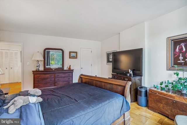 bedroom featuring light parquet floors