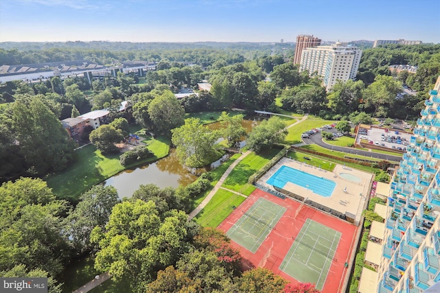 birds eye view of property with a water view