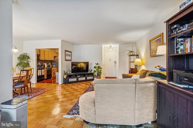 living room featuring parquet floors