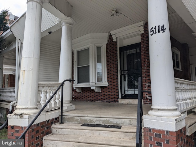 entrance to property with a porch