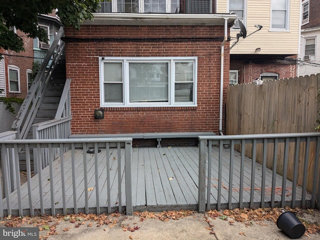 view of home's exterior with a wooden deck