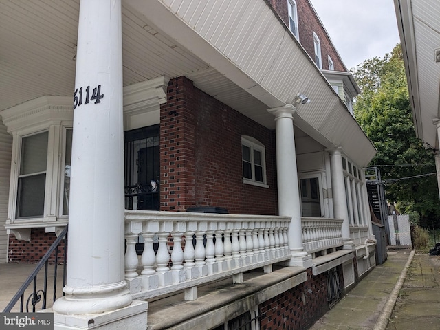 view of side of home featuring a porch