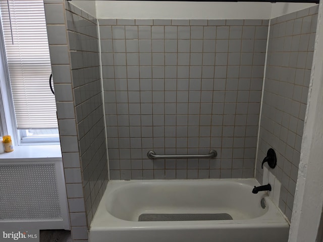 bathroom featuring radiator heating unit