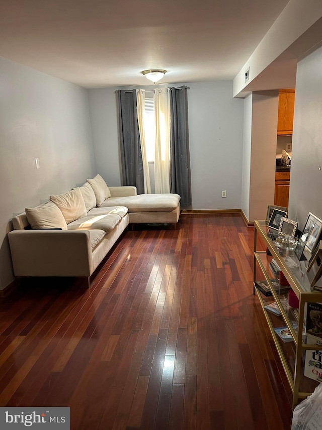 living room with dark hardwood / wood-style floors