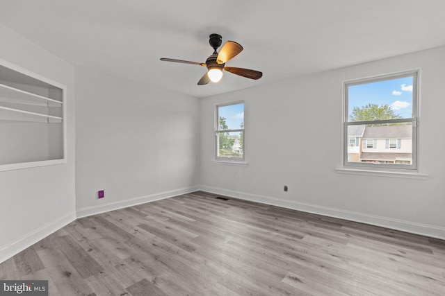 unfurnished bedroom with ceiling fan and light hardwood / wood-style flooring