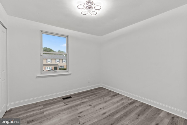 spare room featuring hardwood / wood-style flooring