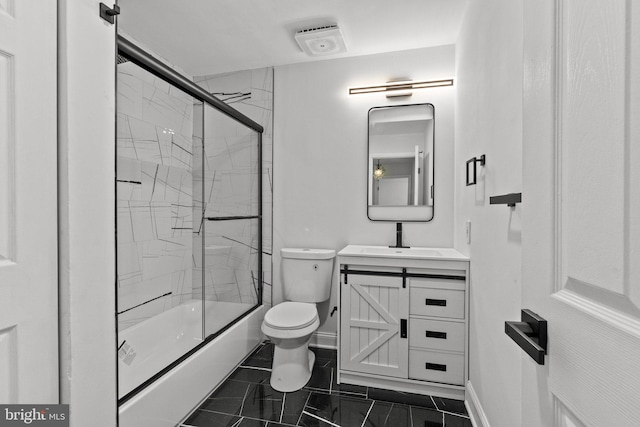 full bathroom featuring combined bath / shower with glass door, vanity, and toilet