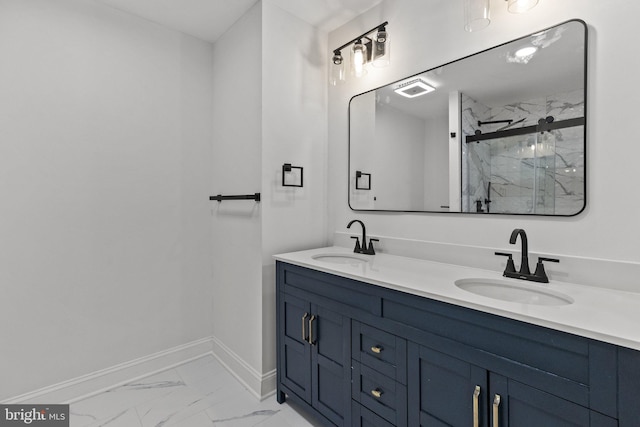 bathroom with vanity and a shower with shower door