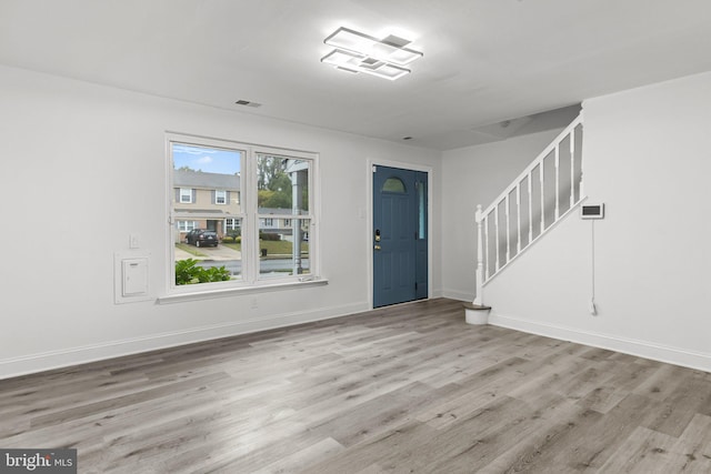 foyer entrance with light wood-type flooring