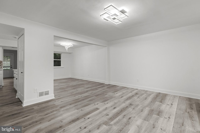 spare room featuring light hardwood / wood-style floors