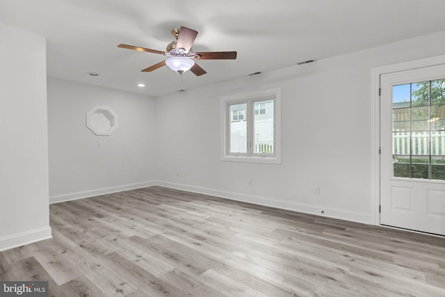 unfurnished room with ceiling fan and light hardwood / wood-style flooring